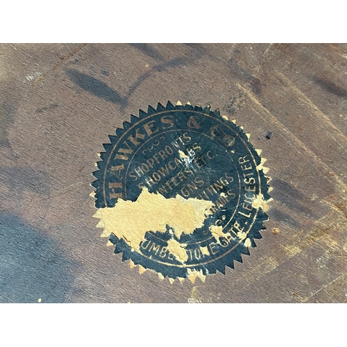 1203 - A gilt wooden framed circular table base with a later brass edged top, label to underside of top. 81... 