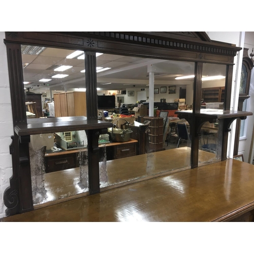 1208 - A Victorian oak sideboard the mirror back above three drawers and cupboards under on a plinth base .... 