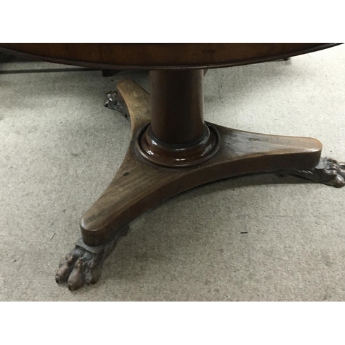 1209 - A Victorian dining table the circular top on a turned column and platform base diameter of top 110cm... 