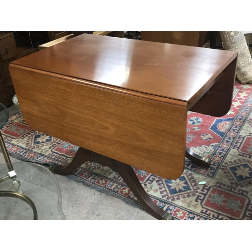 1210 - A George III style dining table with four chairs upholstered in black and white check. The approxima... 