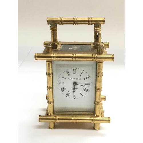1231 - A small brass carriage clock with bamboo style decoration, approx height 11cm.