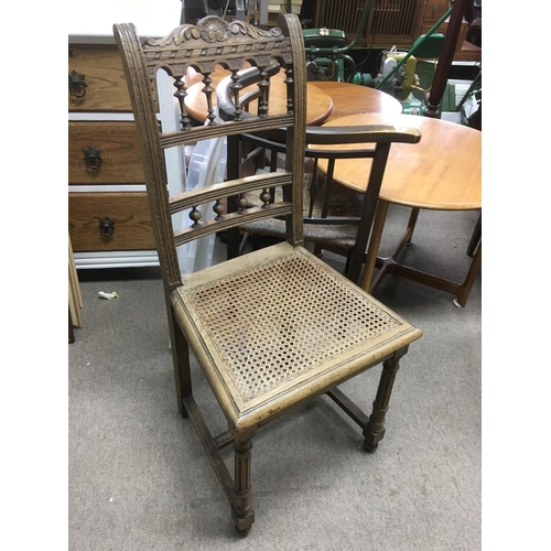 1237 - A French carved oak chair with bergere seat.