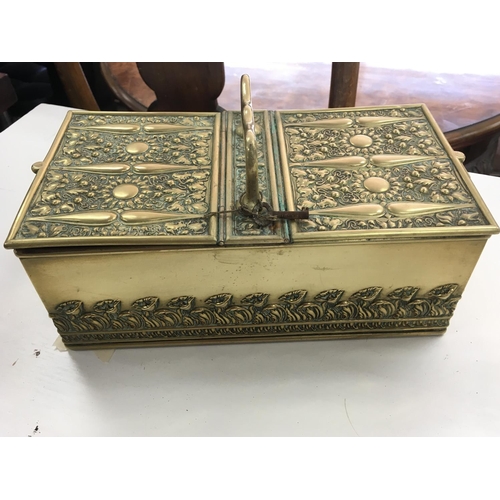 1240 - A good quality vintage brass box with a handle and two locking drawers, with embossed decoration. In... 