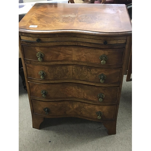 1243 - A walnut serpentine chest of drawers with a brushing slide above four graduating drawers on bracket ... 