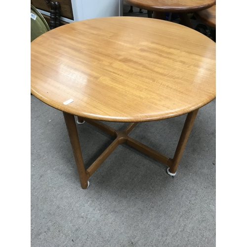 1255 - A Norwegian circular occasion table the tapering legs United by x frame stretchers