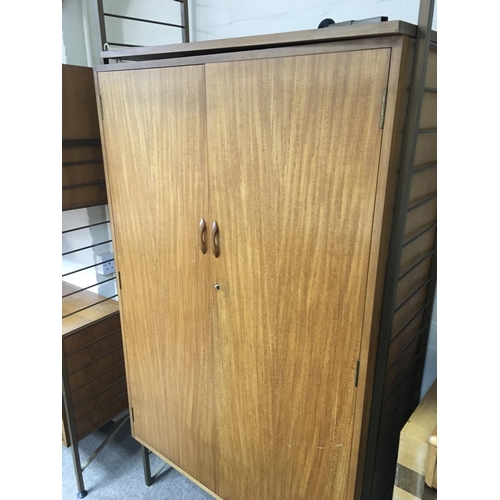 1264 - A ladder back two door cupboard. 90 by 190 cm .