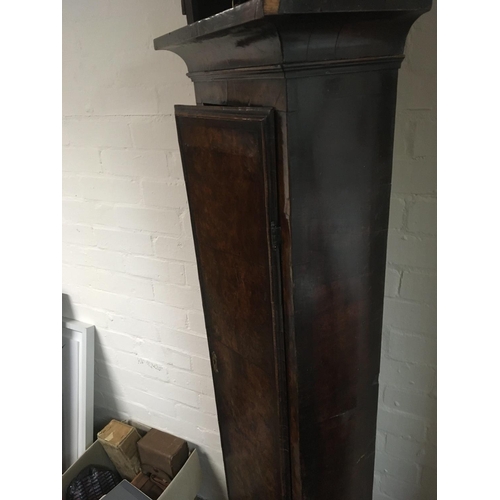 1267 - A George II 18th Century Walnut long case clock with a caddy top and fretwork panels the brass dial ... 