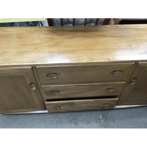 1268 - A Ercole sideboard fitted with three drawers flanked by a pair of cupboard doors