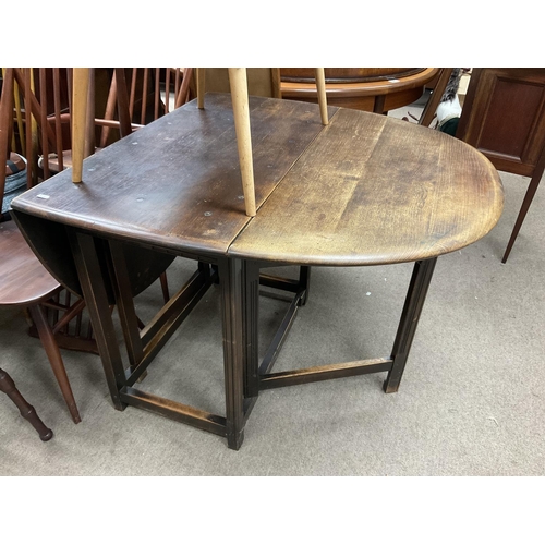 1276 - A dark stained oak folding dining table.