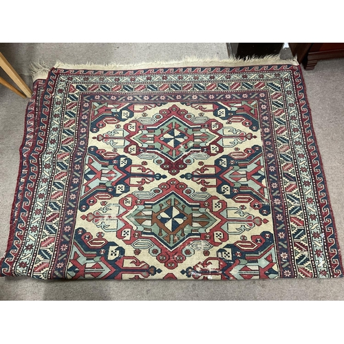 1292 - A Turkish hand knotted rug with geometric design. 244cm x 150cm.