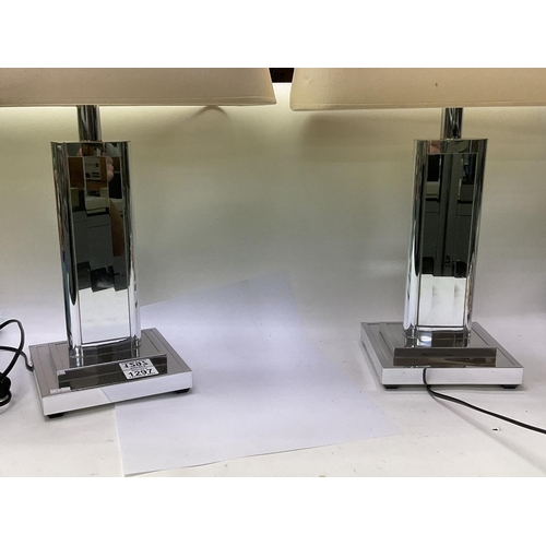 1297 - A pair of modern design mirrored lamp bases.