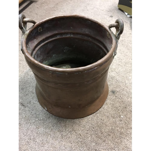 960 - A Collection of ceramic wall pockets and a copper bucket.