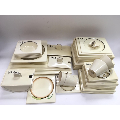 964 - A collection of over 50 Clarice Cliff Art Deco Biarritz dinner and tea service items, mostly monogra... 