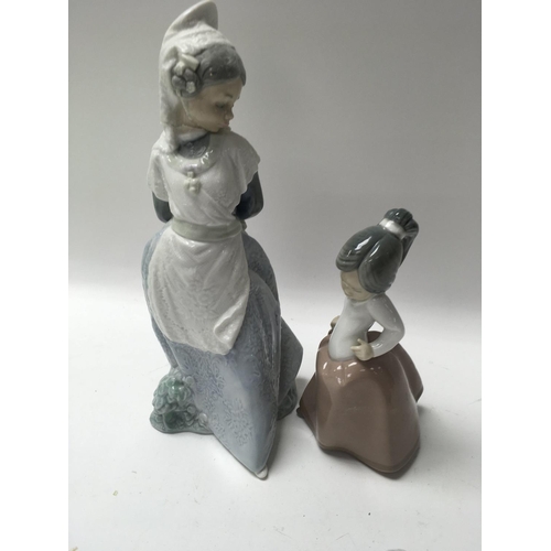 982 - Two Lladro figures comprising boy and dog , a Princess , and two Nao figures.