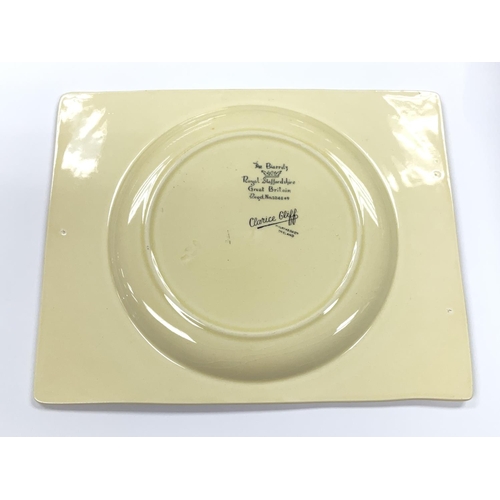 988 - A Clarice Cliff orange taormina plate.