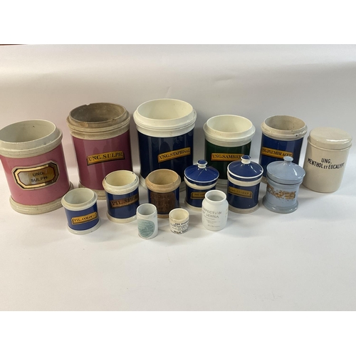 993 - A collection of creamware chemist pots, originally used for bulk quantity pharmacy purposes. Most ha... 