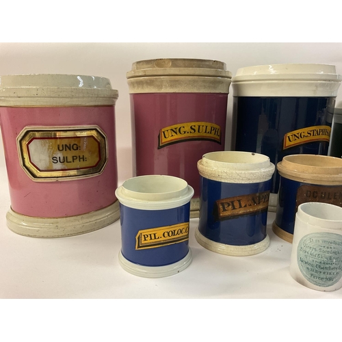 993 - A collection of creamware chemist pots, originally used for bulk quantity pharmacy purposes. Most ha... 