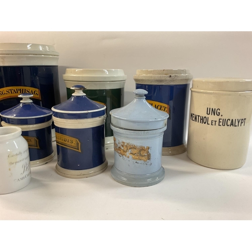 993 - A collection of creamware chemist pots, originally used for bulk quantity pharmacy purposes. Most ha... 