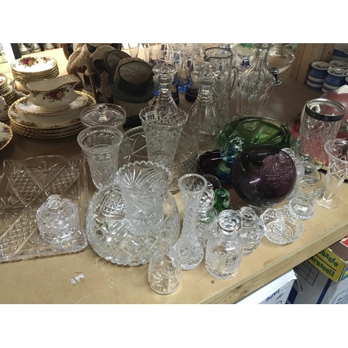 999 - A collection of cut glass decanters a silver rimmed vase paperweights and other items (a lot)