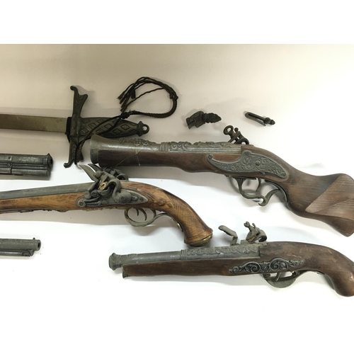 2034 - A collection of replica firearms including flintlock - revolver - musket.