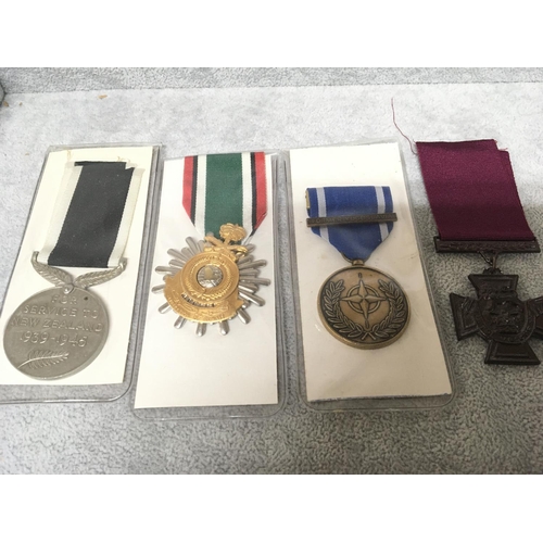 2045 - A collection of medals a replica VC Yugoslavia medal New Zealand Service medal and Liberation of Kuw... 