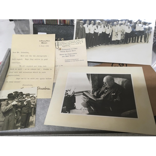 2049 - A 1941 Photograph of Sir Winston Churchill working whist on a train and signed by Sir Winston Church... 