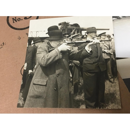 2049 - A 1941 Photograph of Sir Winston Churchill working whist on a train and signed by Sir Winston Church... 