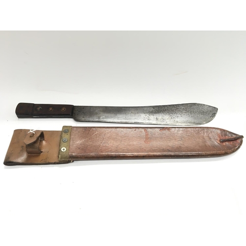 2059 - A British army machete marked on leather scabbard B.H & G Ltd 1955 Barrow Hepburn & Gale.