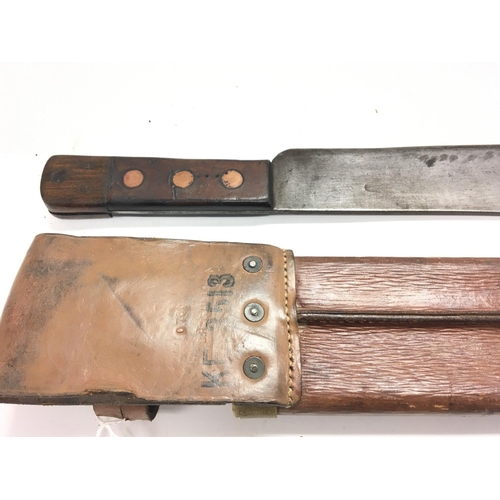 2059 - A British army machete marked on leather scabbard B.H & G Ltd 1955 Barrow Hepburn & Gale.