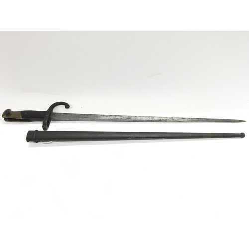 2063 - 1877 Gras bayonet (M1874) scabbard. Functioning leaf spring release catch.