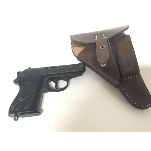 2076 - A replica James Bond favourite Pistol A Waltham PPK serial number 382480 with a leather holster.