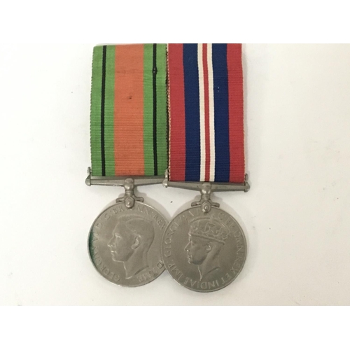 2097 - Two II world war medals the defence medal and Victory medal (2)