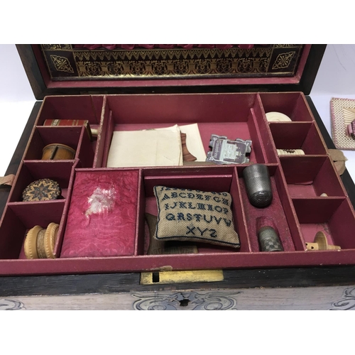 760 - A Recency work box with brass inlay enclosing a fitted interior with various sewing tools .