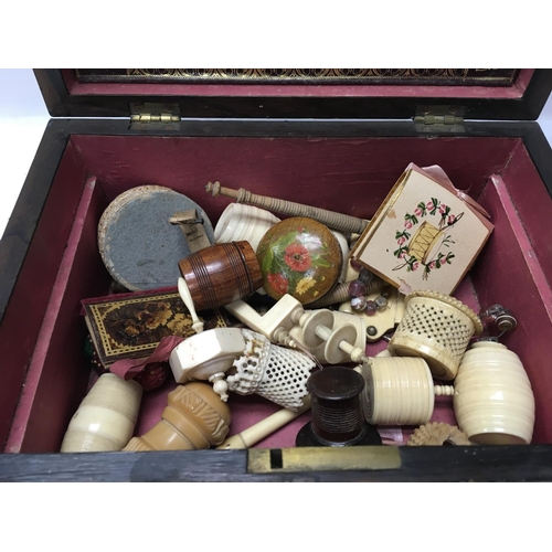760 - A Recency work box with brass inlay enclosing a fitted interior with various sewing tools .