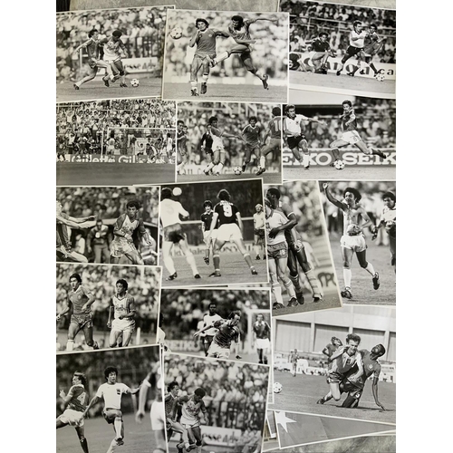 129 - 1982 World Cup Football Photos: Black and white 10 x 8 photos with press stamps and annotations to r... 