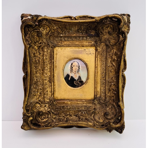 2027 - A gilt framed portrait miniature of Elizabeth Barrett Browning and Flush her cocker spaniel, inscrib... 