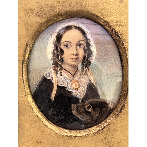 2027 - A gilt framed portrait miniature of Elizabeth Barrett Browning and Flush her cocker spaniel, inscrib... 