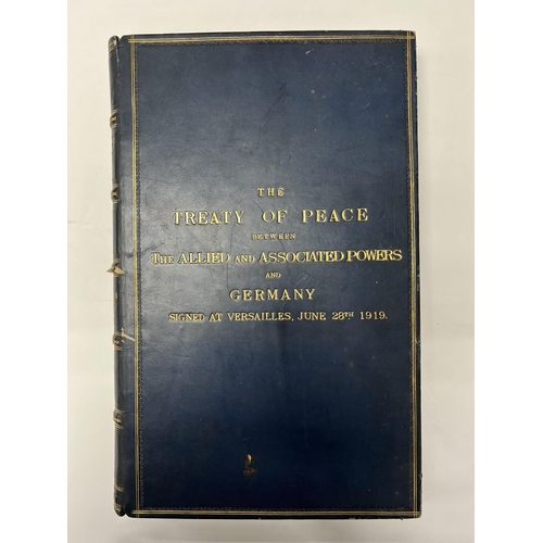 2072 - A blue leather bound edition titled the treaty of peace between the Allied and associated powers and... 