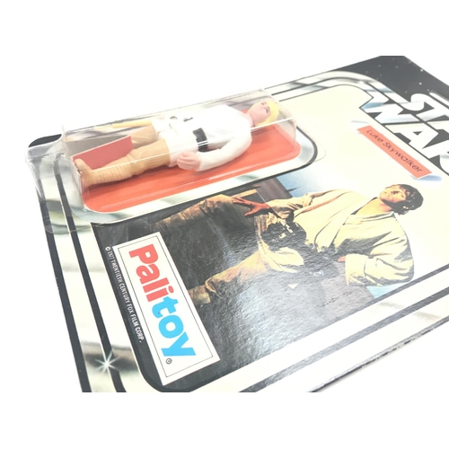 1 - A Vintage Star Wars Palitoy 1977 Carded Luke Skywalker. One of the first 12 Figures released.