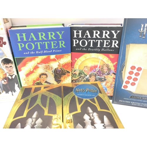 104 - A Collection of Harry Potter Items including 2 First Edition Books. Puzzles. And a Memory set.