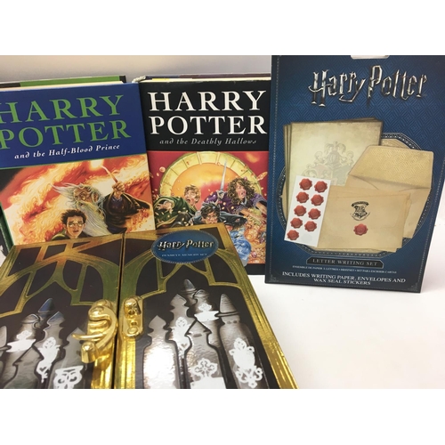 104 - A Collection of Harry Potter Items including 2 First Edition Books. Puzzles. And a Memory set.