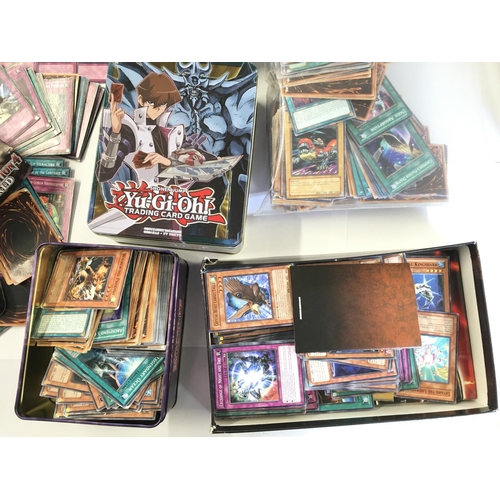 112 - A Box Containing A Collection of Yu-Gi-Oh Cards and Tins.