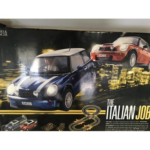 119 - A Boxed TCR Racing Set and a M&S Italian Job Racing Set.(2)