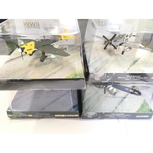 138 - A Collection of 4 Corgi WW2 Legends Aircraft including a P-51D Mustang. A F4U Corsair. A P-40F Warha... 