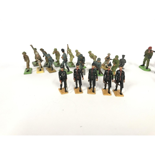 211 - A collection of various toy soldiers including Langley and Britain's.