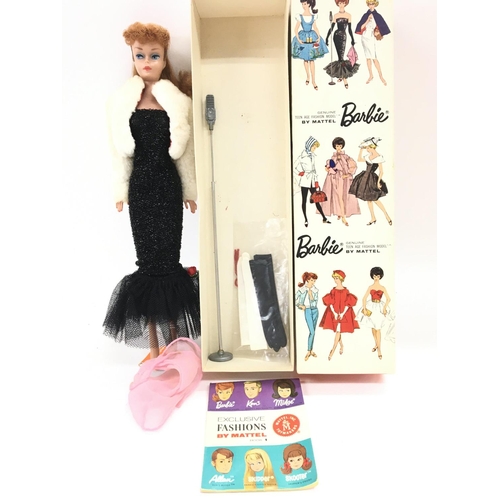 25 - A Boxed Vintage Barbie from 1962 under the spotlight. #850 Redhead. Ponytail.