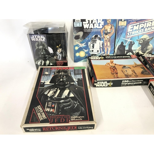 268 - Collection of vintage Star Wars puzzles and read along book and record.