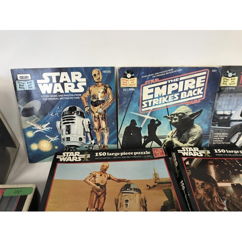 268 - Collection of vintage Star Wars puzzles and read along book and record.