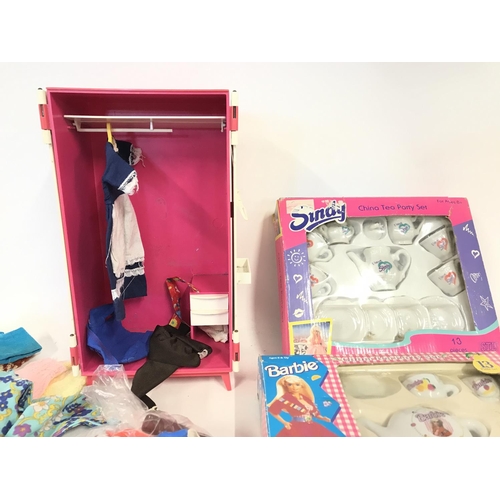 271 - Various Sindy clothes and accessories including wardrobe and China tea sets.