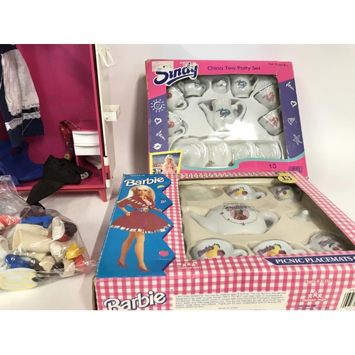 271 - Various Sindy clothes and accessories including wardrobe and China tea sets.